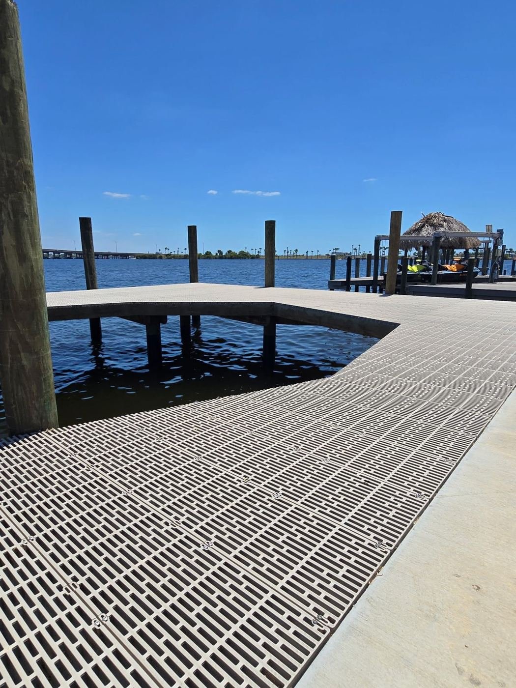 Curved walkway with grated decking