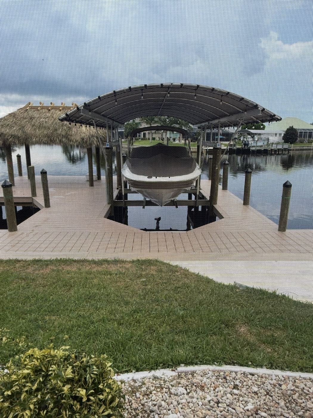 Canopy lift beside a tiki hut