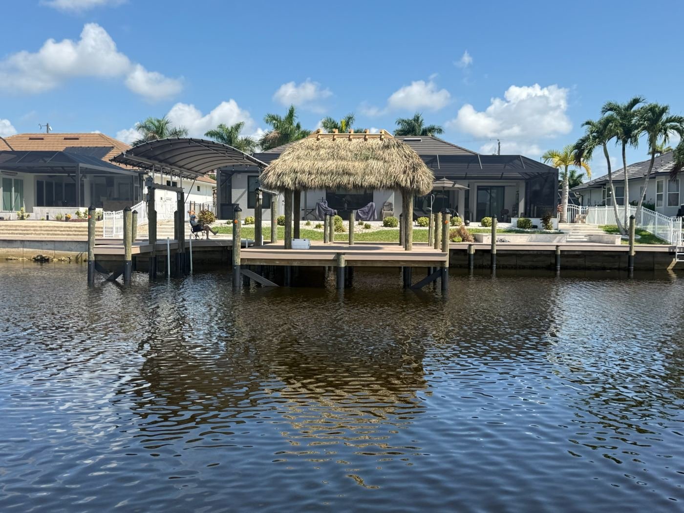 Vinyl dock with a tiki hut and covered boat lift
