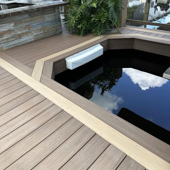 Boat lift slip in Brownstone vinyl decking with picture framing
