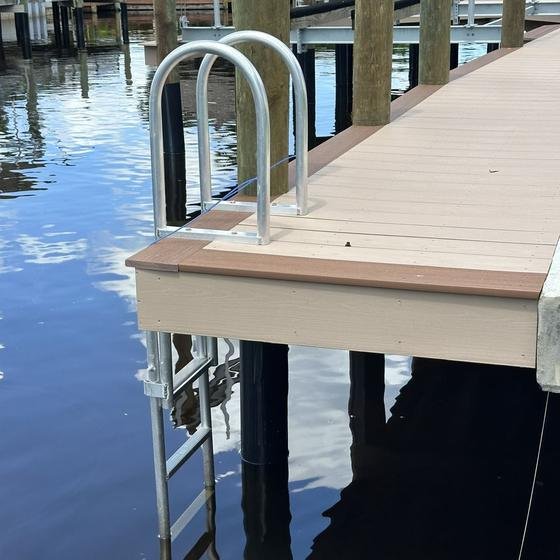 Slate Gray vinyl dock end with Brownstone picture framing and a stainless swim ladder
