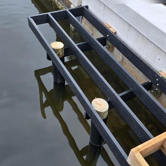 Kayak launch framing and pilings going in beside the seawall