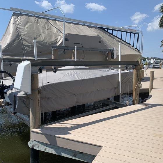 Vinyl dock beside a boat on a covered lift