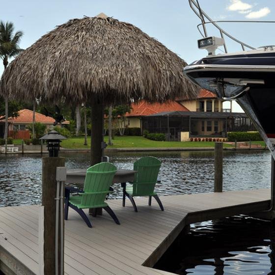 Tiki hut and boat lift on a canal dock