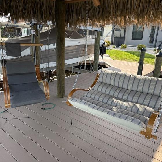 Hanging swing chairs under a new tiki hut