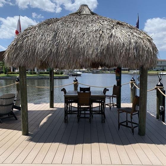 Square thatched tiki hut over a dining table on a Slate Gray vinyl dock